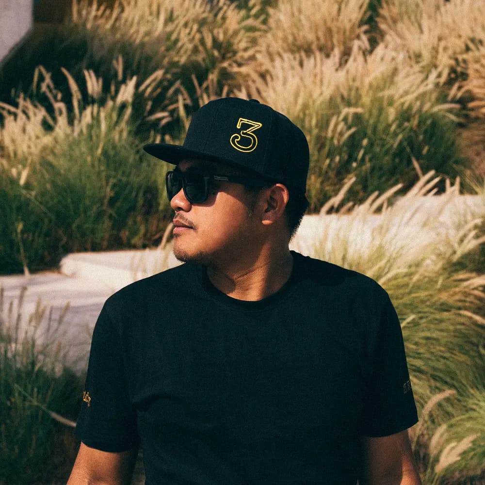 3Fils team member in branded cap enjoying the outdoors