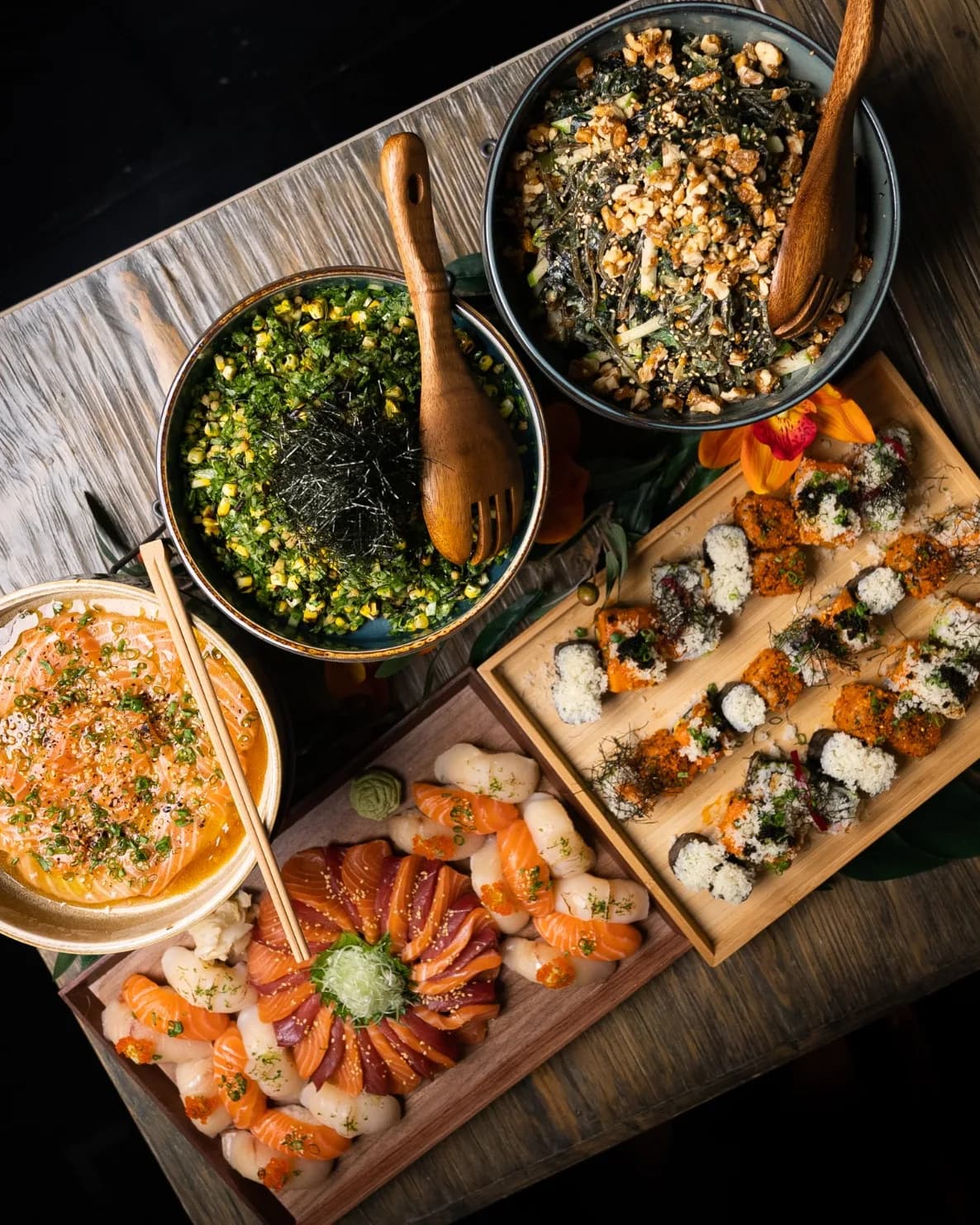 Full 3Fils catering spread with sushi platters, maki rolls and sharing salads
